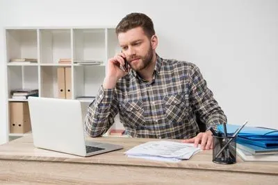 man scheduling a dental appointment at Dat Complete Dentistry