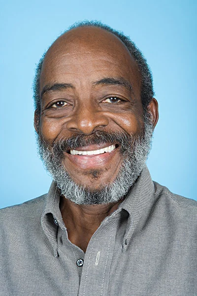 man smiling with his new dental implants from Dat Complete Dentistry