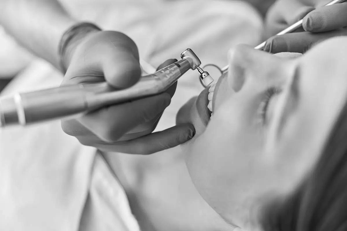 patient receiving dental care at Dat Complete Dentistry